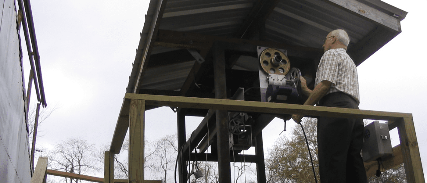 Max Wilson working on early hoist equipment